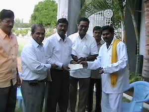 Giving donation for Sri Krishna Devaraya University